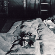 Architect with Model of the Quad (1927)